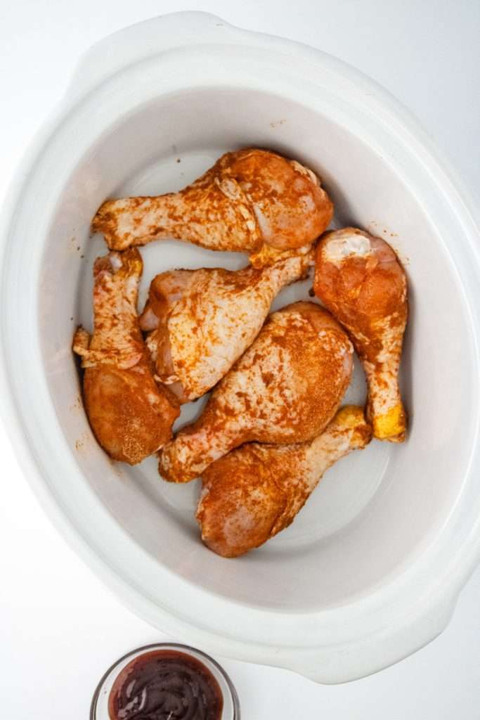 Season all sides of the chicken legs.