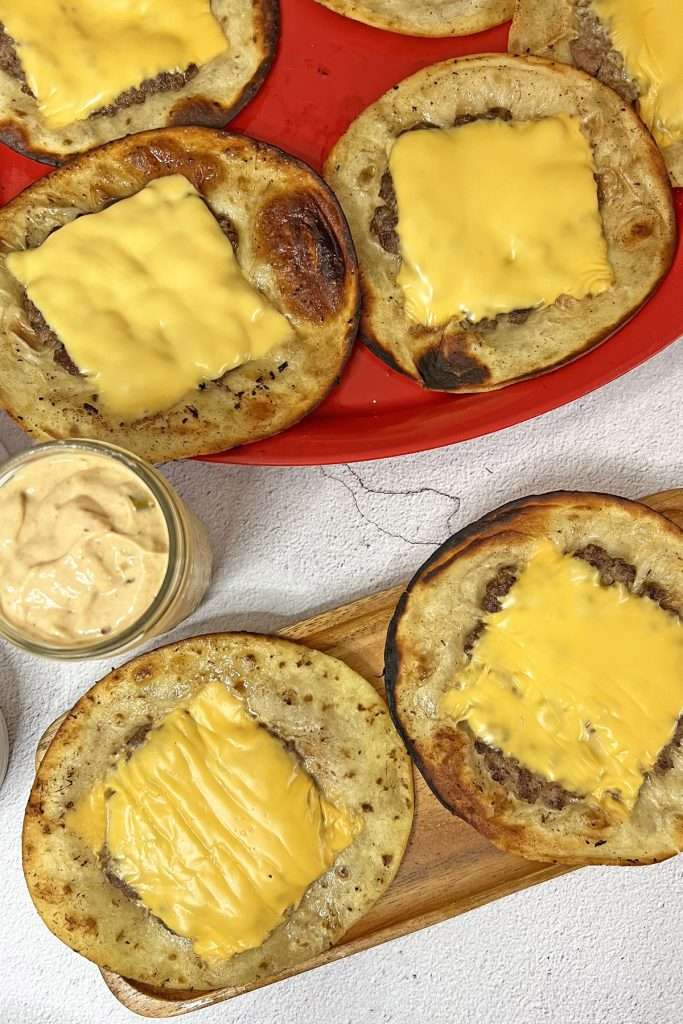 Add sauce and toppings