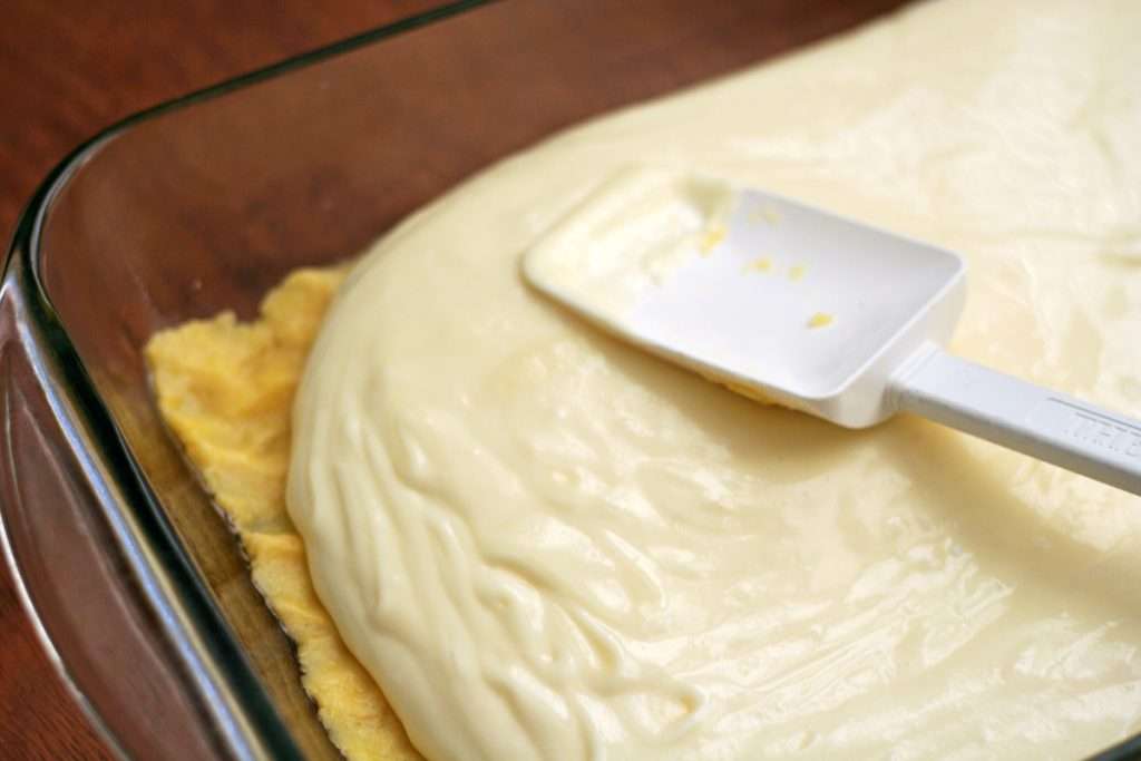 Spread over the crust layer. 