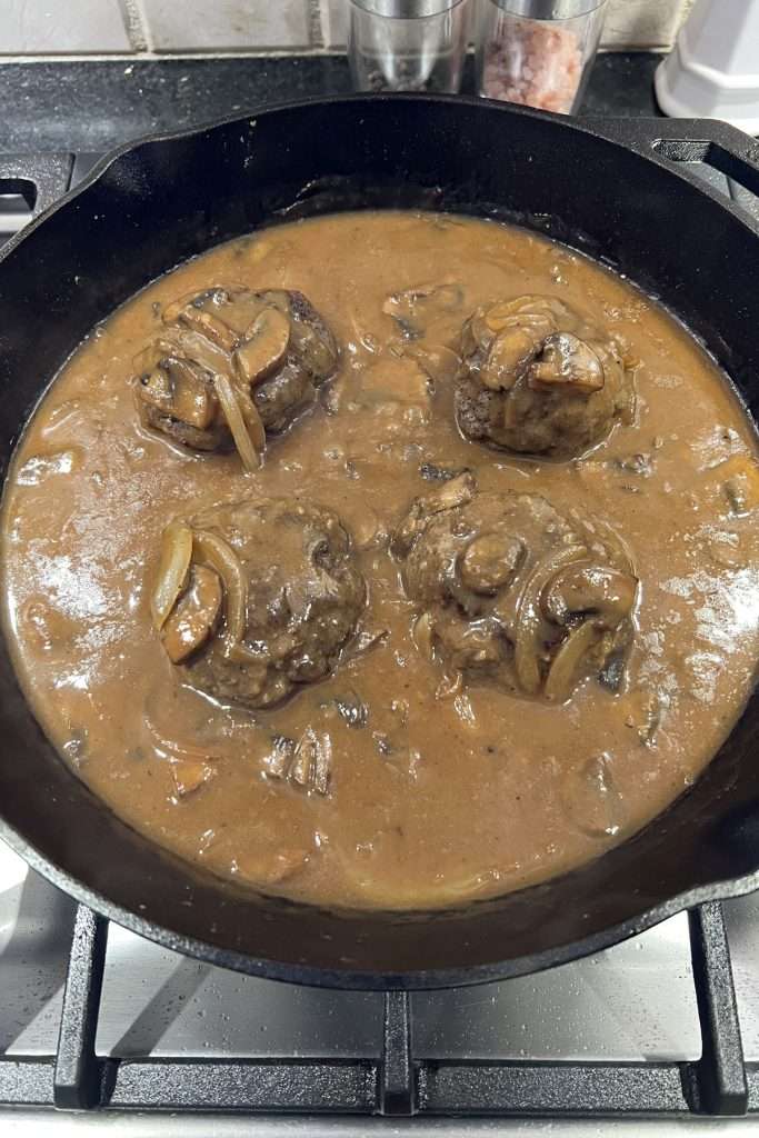 Return patties to pan and cover with sauce.