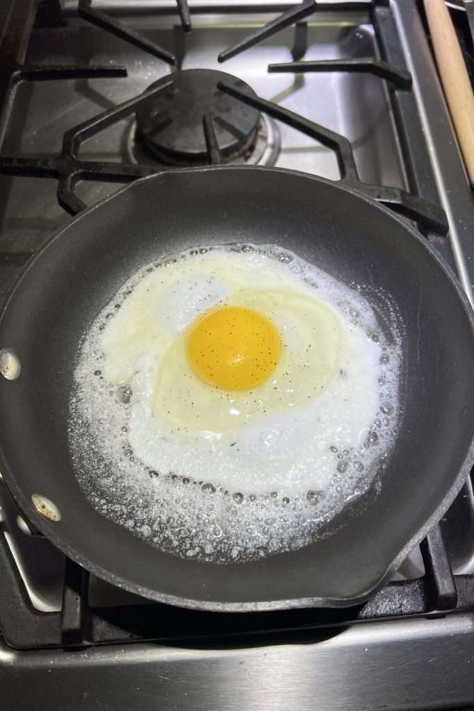 Fry eggs in a separate pan in butter or oil.