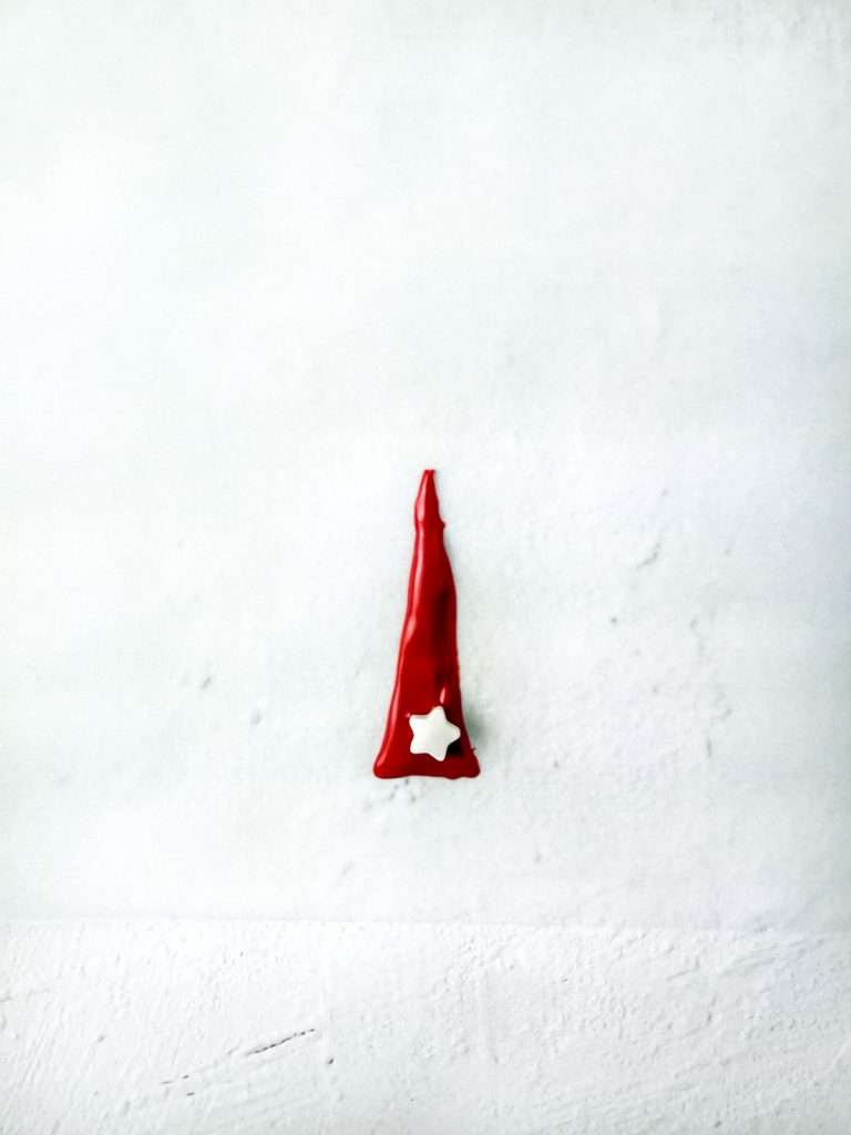 Pipe 2-inch triangles and decorate with sprinkles.