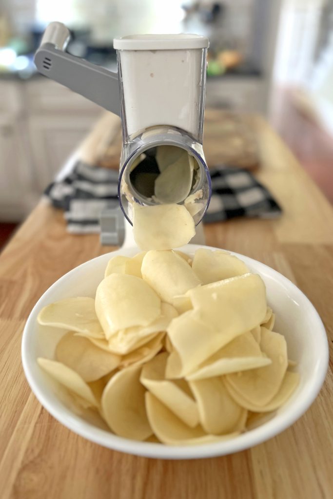 Slice potatoes thinly