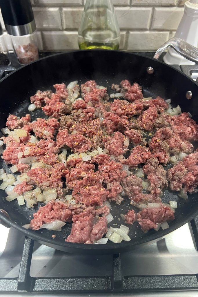 Add ground beef into the pan.