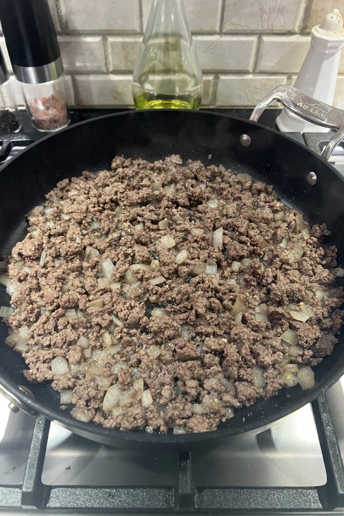 Cook until beef is browned and add seasoning.