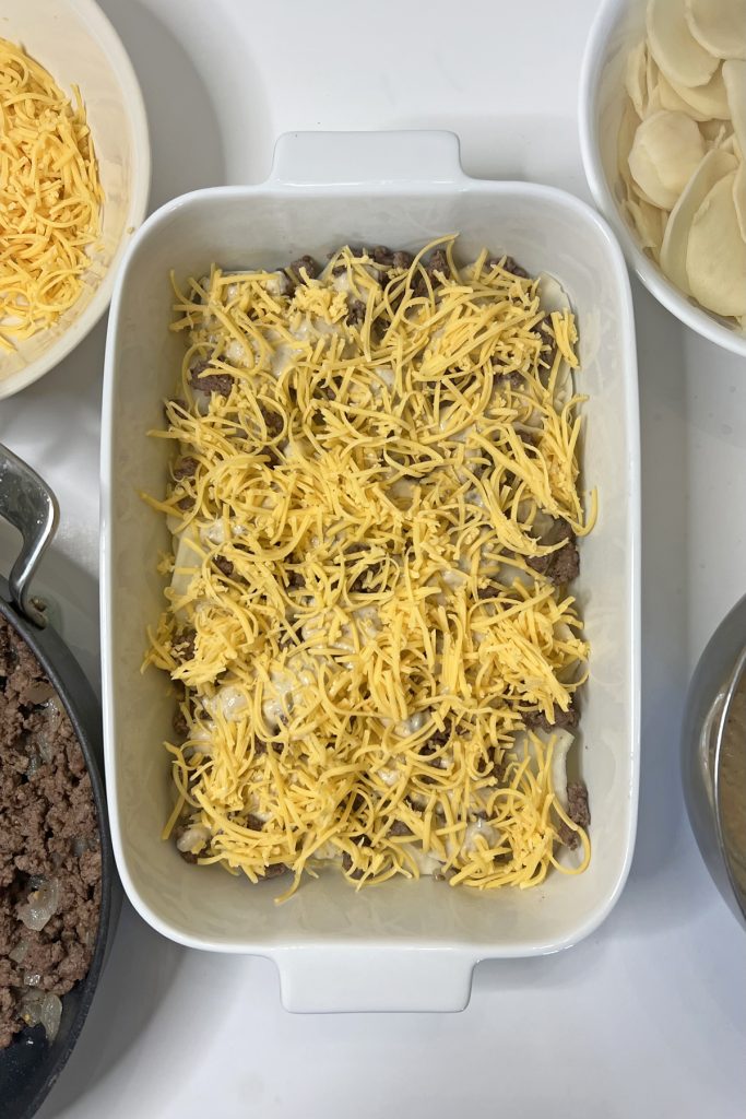 Add half of the shredded cheese