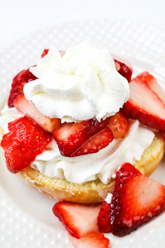 Add a dollop of whipped cream over the strawberries.