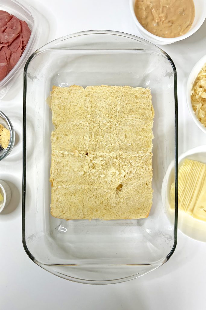 Place bottom layer of the rolls in a prepared baking dish.