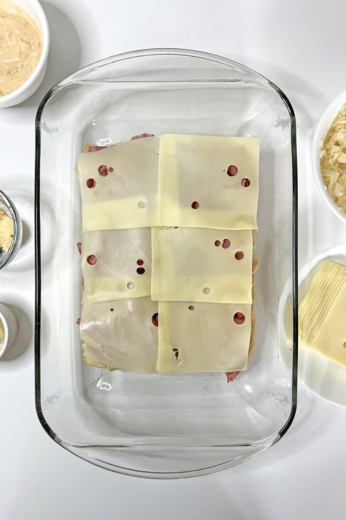 Top with slices of Swiss cheese.