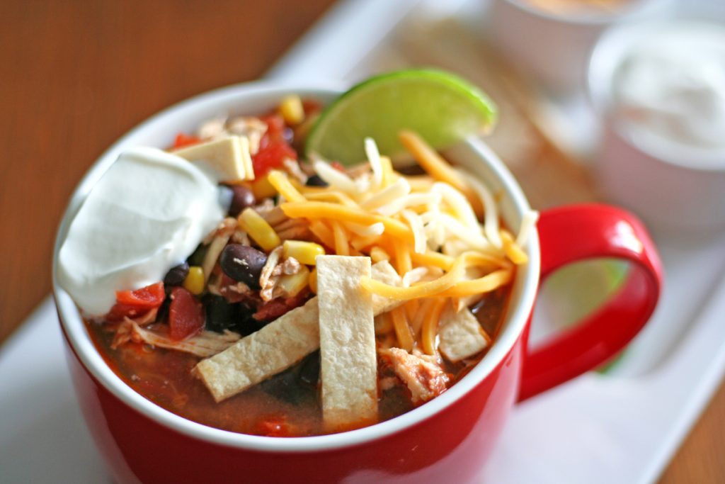 Slow Cooker Chicken Taco Soup with toppings