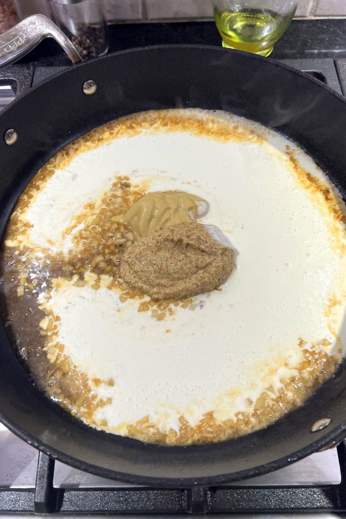 Add both kinds of mustard and the heavy cream.