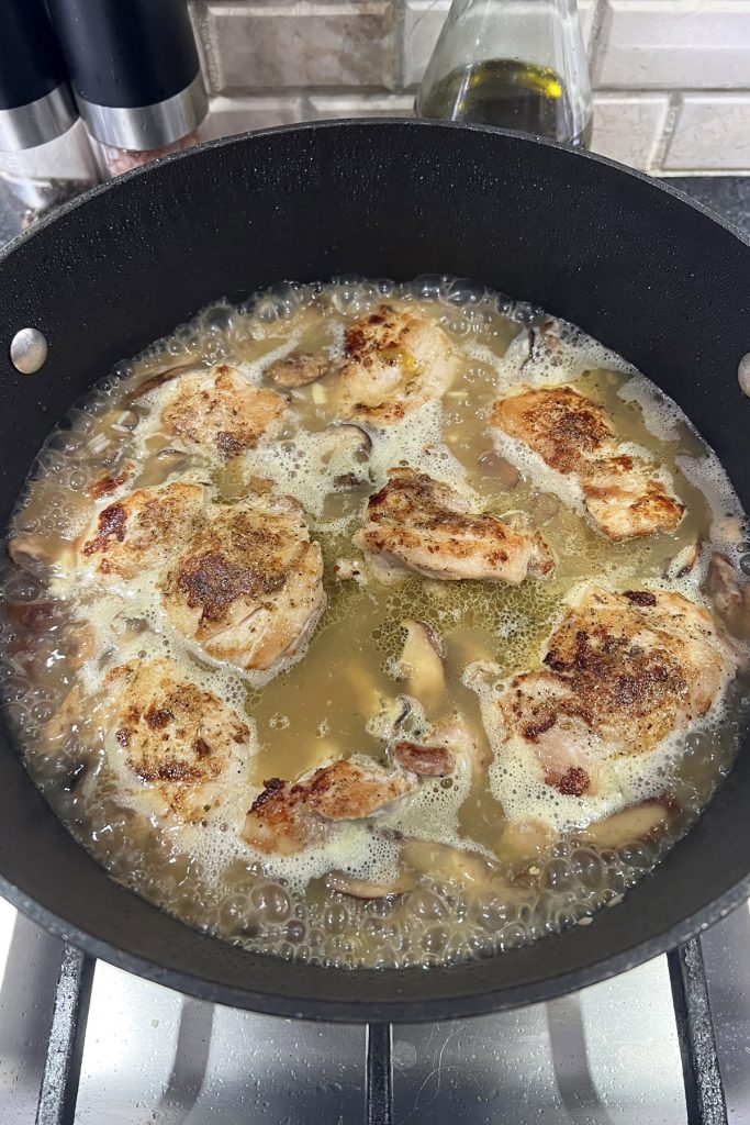 Add chicken pieces back into the skillet.