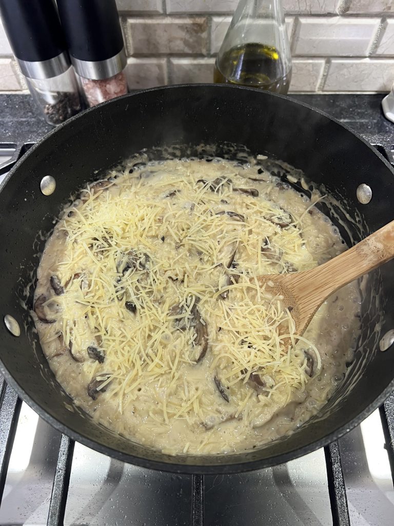 Top with shredded cheese and stir.