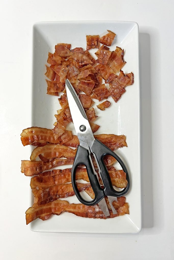 Cook and chop the bacon.