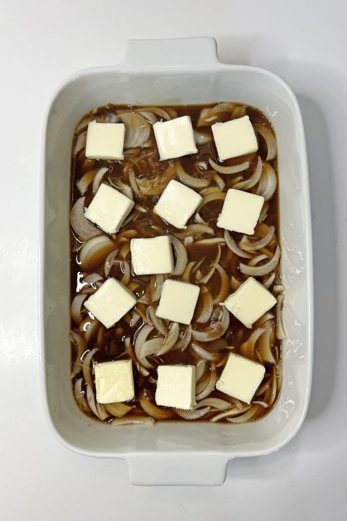 Add pats of butter on top.