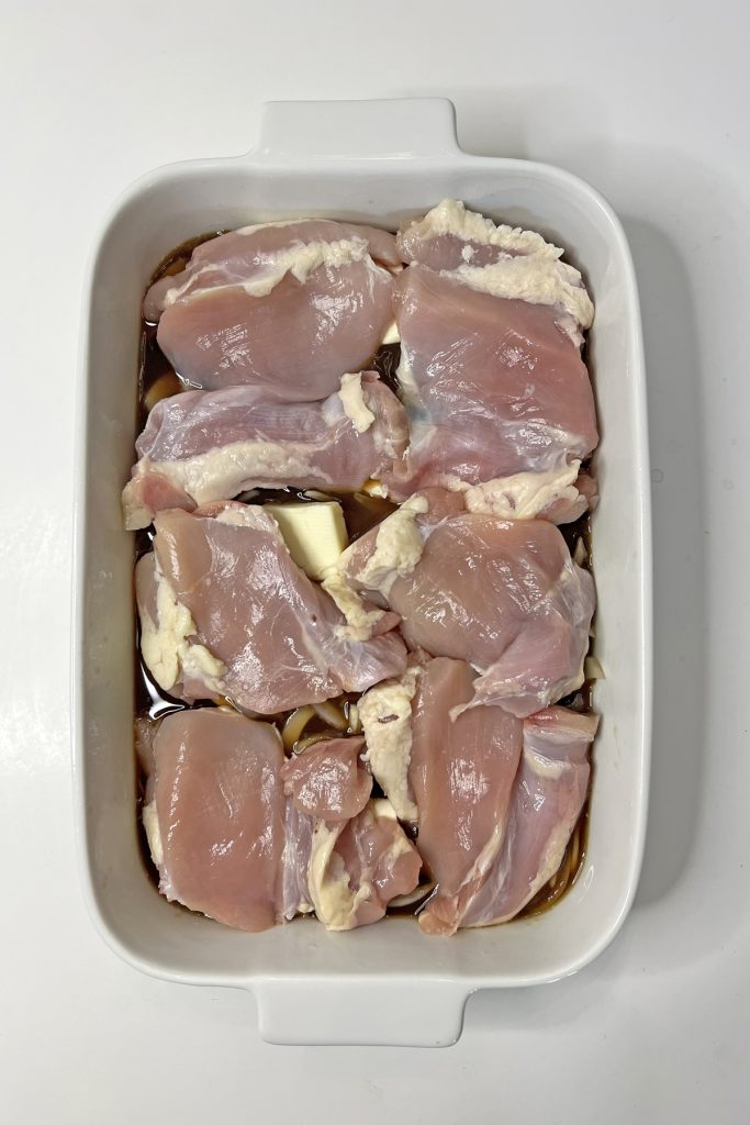 Place chicken thighs on top.