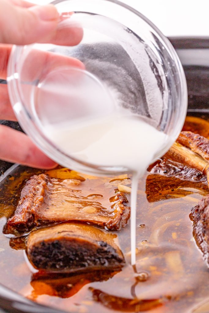 Thicken gravy with a cornstarch slurry.