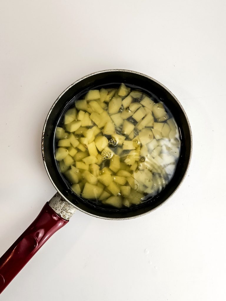 Boil the diced potatoes.
