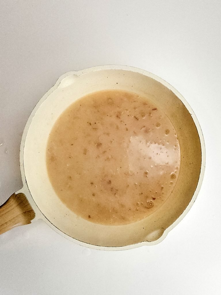 Stir the chicken broth into the roux.