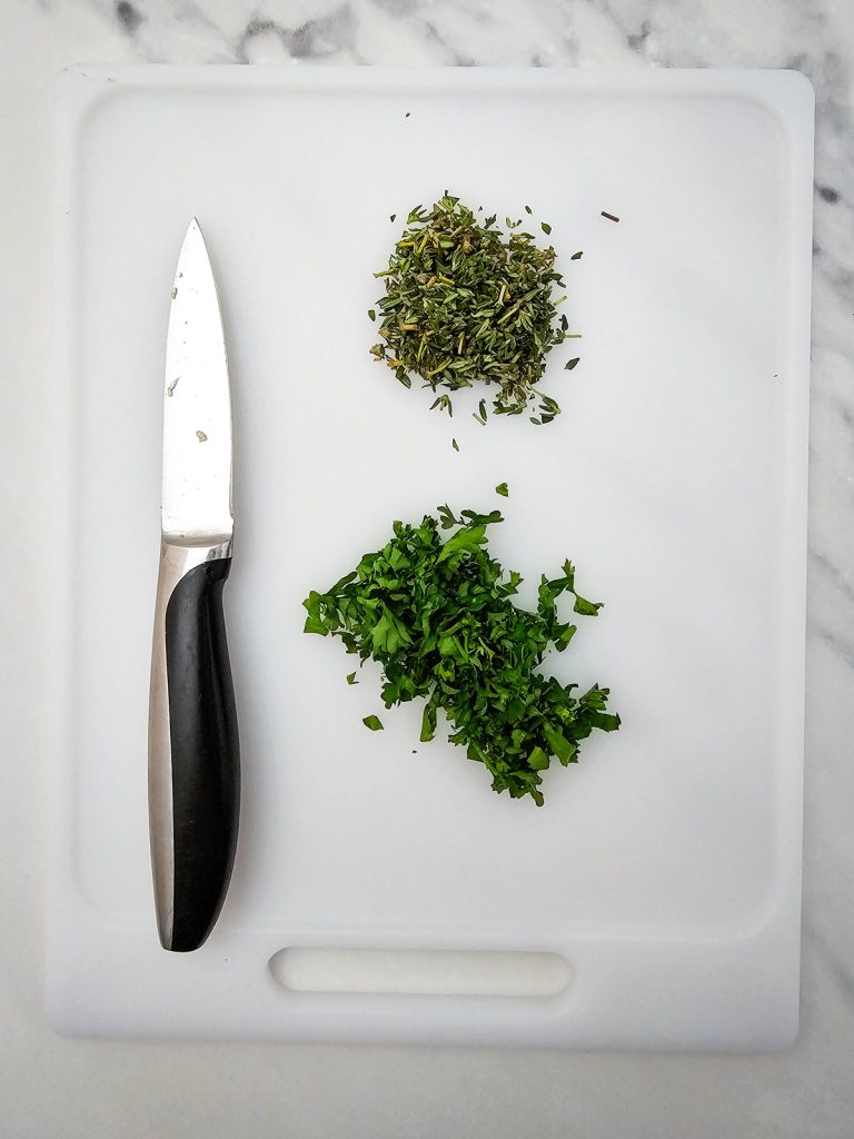 Chop the herbs.