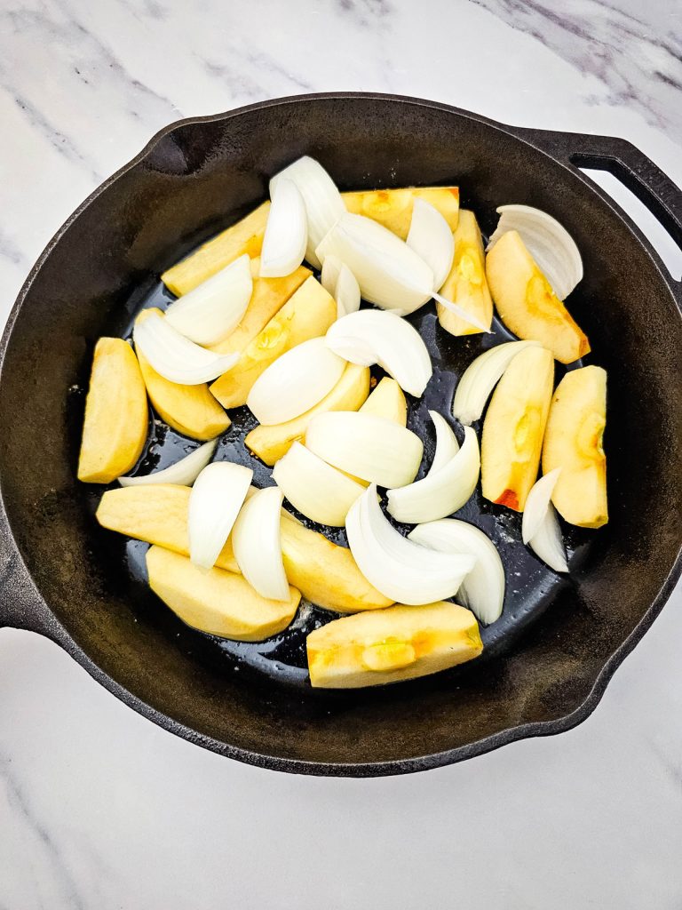 Add apples and onions to the skillet.