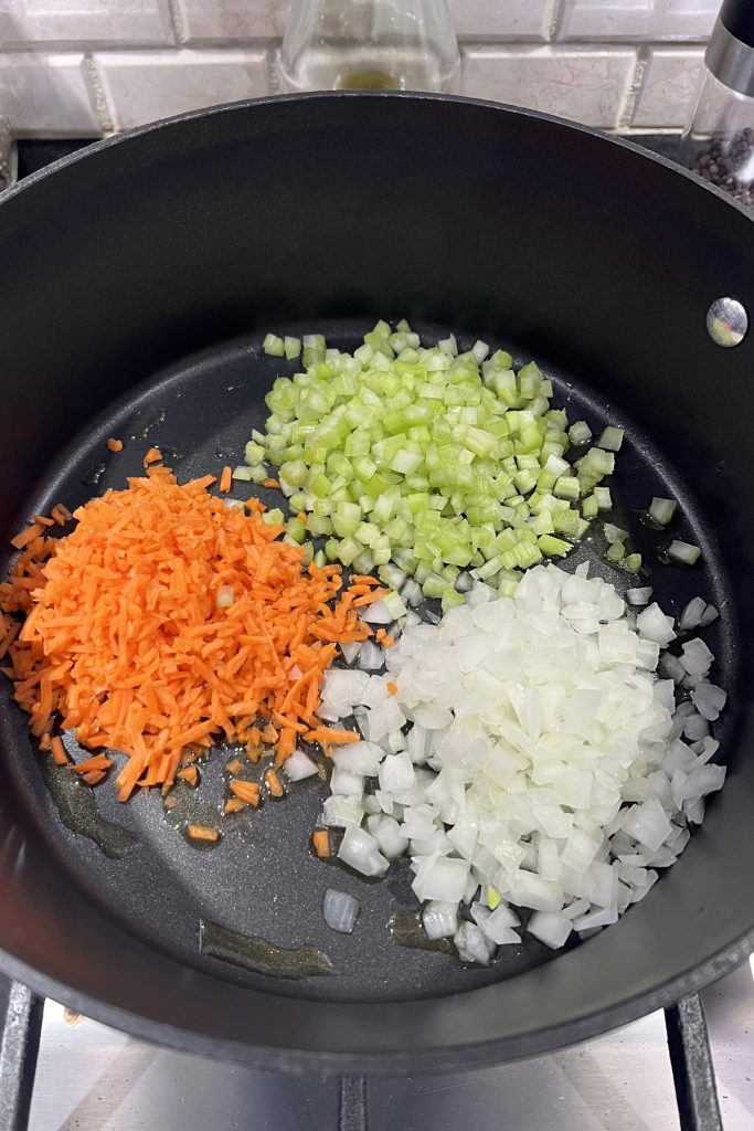 Add diced veggies to a large skillet.