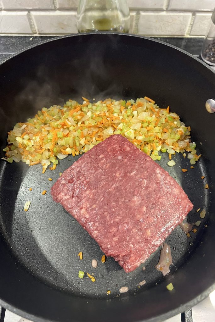 Add ground beef.
