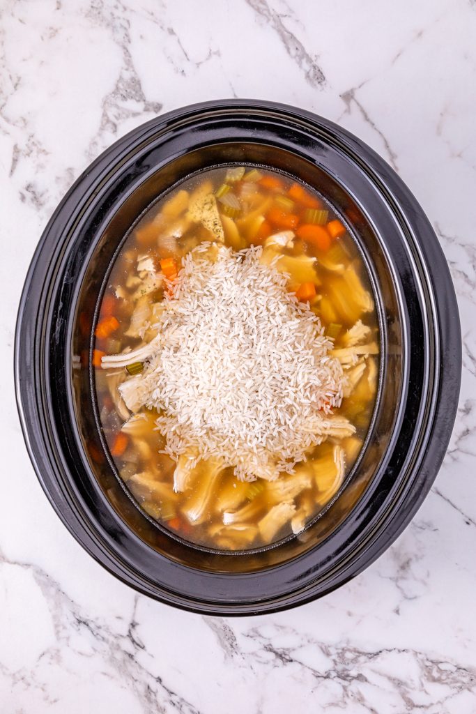 Add uncooked rice in the last hour of cooking