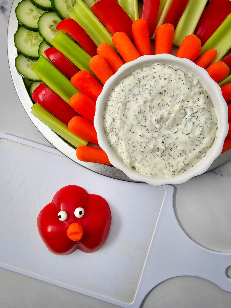 add turkey eyes to a red bell pepper
