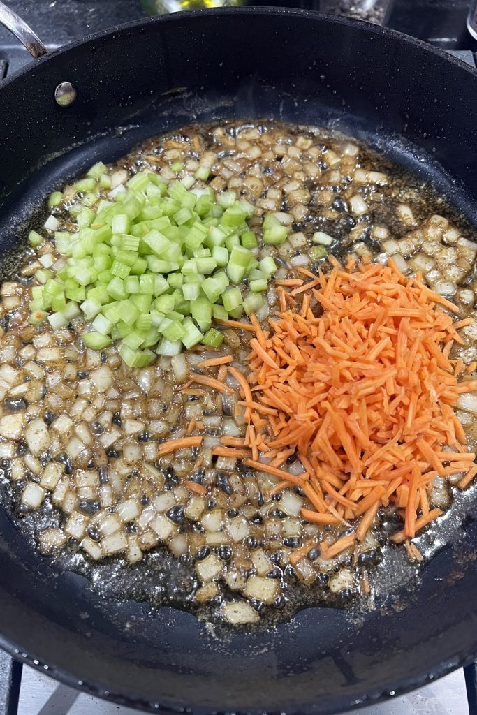 veggies sauteeing in a skillet