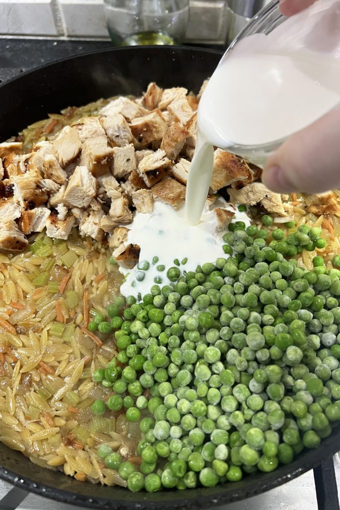 Add vegetables, cream, and cooked chicken.