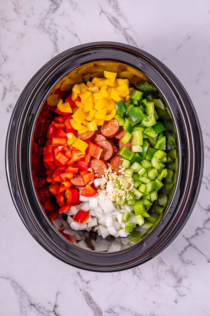 Add diced vegetables on top of meats.