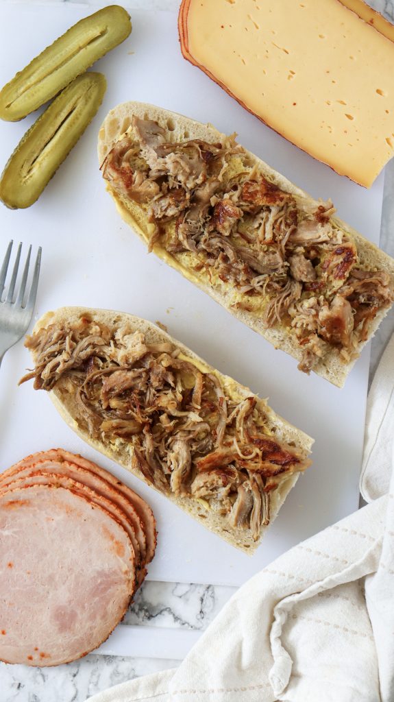 Bread with pulled pork on top.