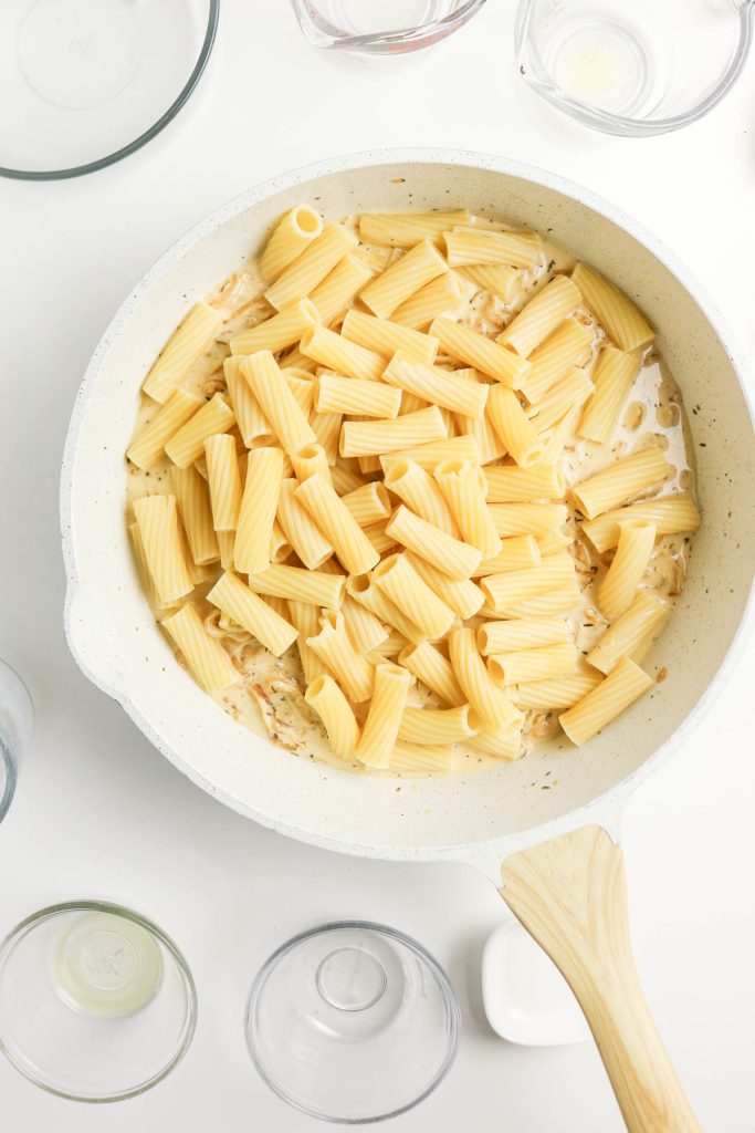 Add cooked pasta.