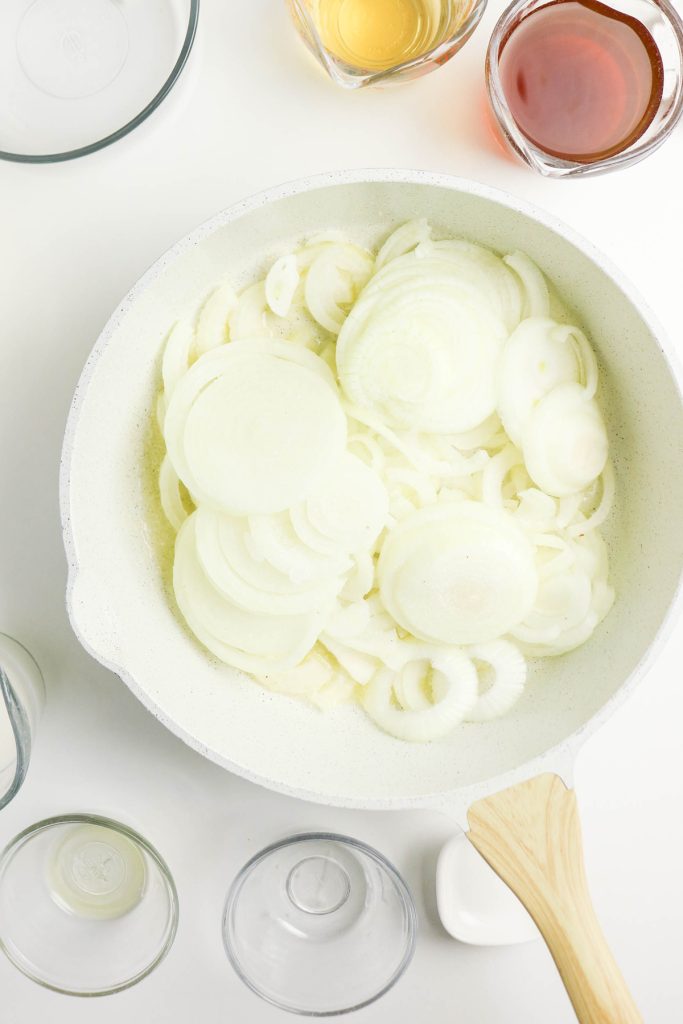 Sliced onions in a skillet.