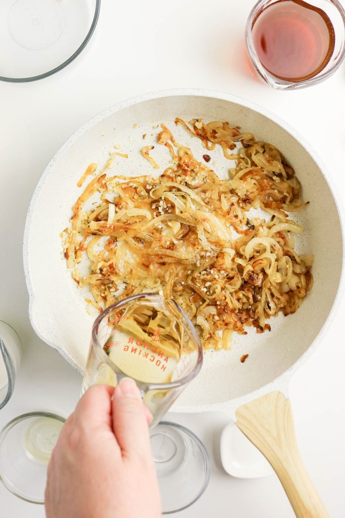 Deglaze the pan with white wine.