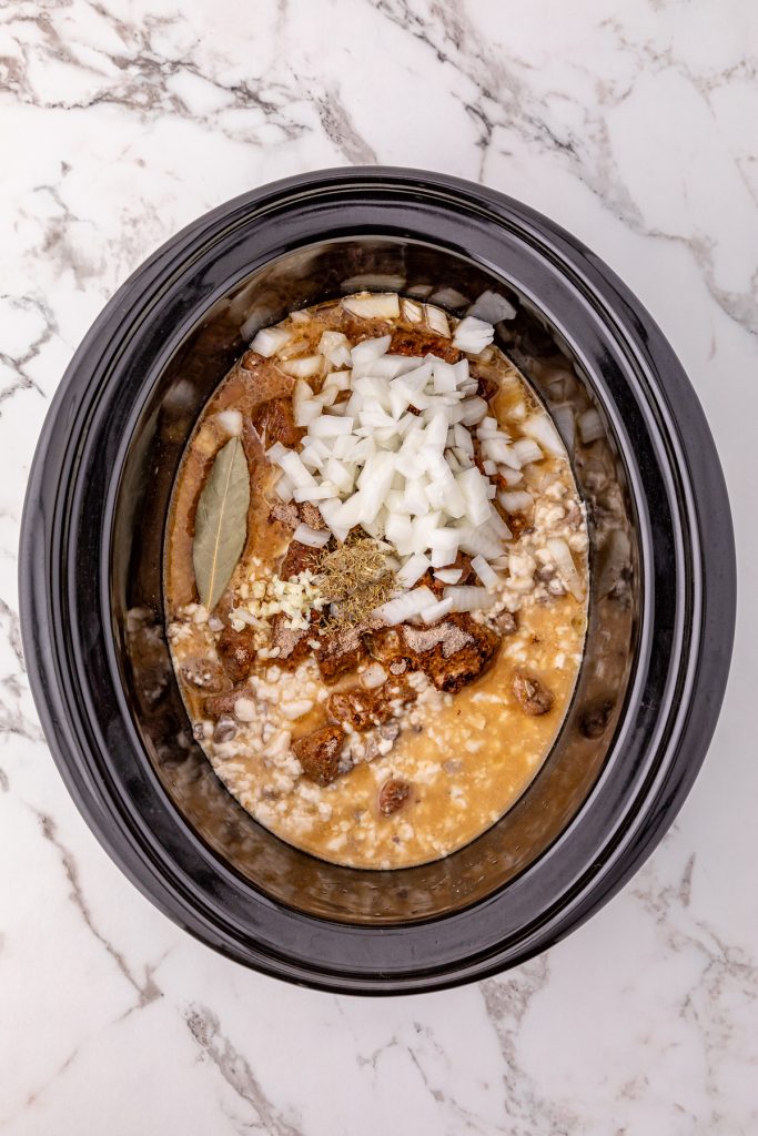 Ingredients for beef tips and gravy in a crockpot.