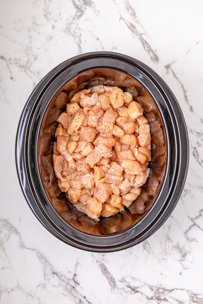 Seasoned chicken in a crockpot.
