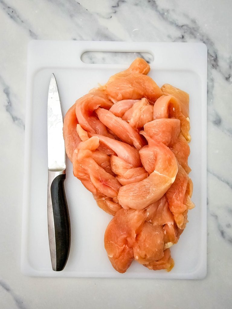 Chicken breast cut into thin strips.