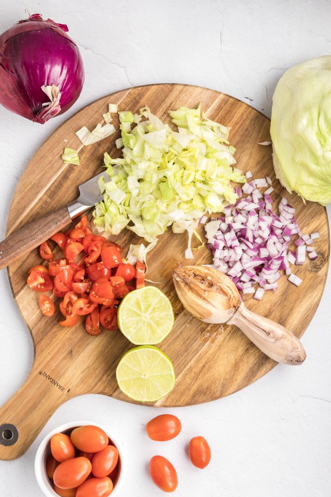 Chopped veggies on a wooden cutting board.