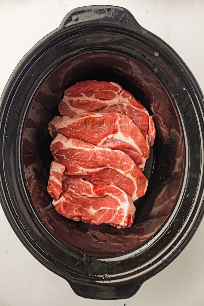 Pork steaks in a crockpot.