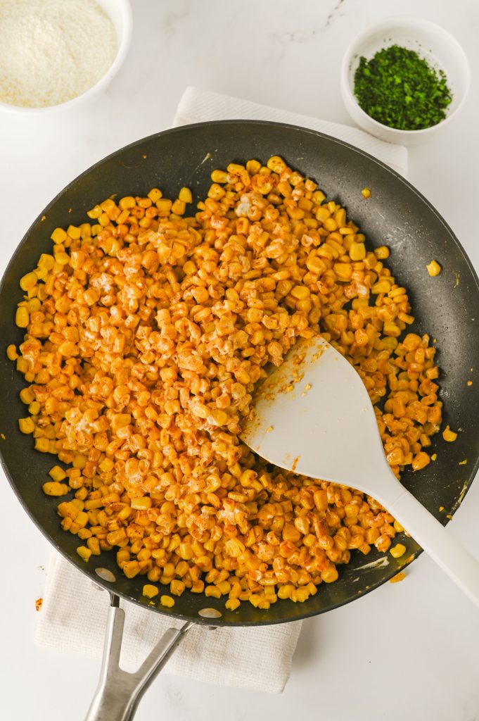 Mexican Street Corn Off the Cob cooking in a skillet.