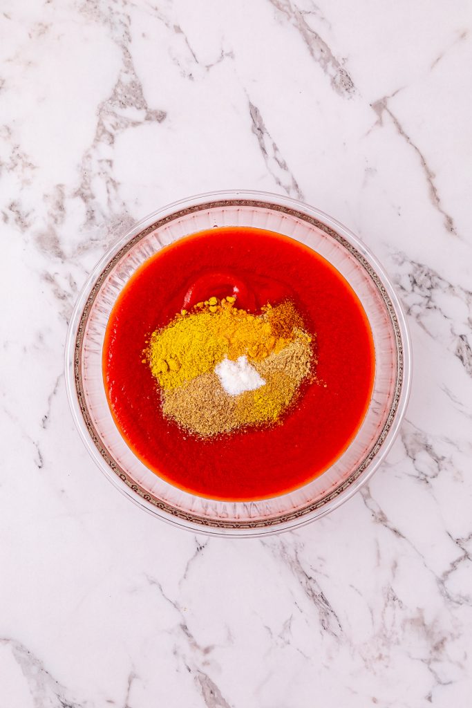 Tomato sauce and spices in a small bowl.