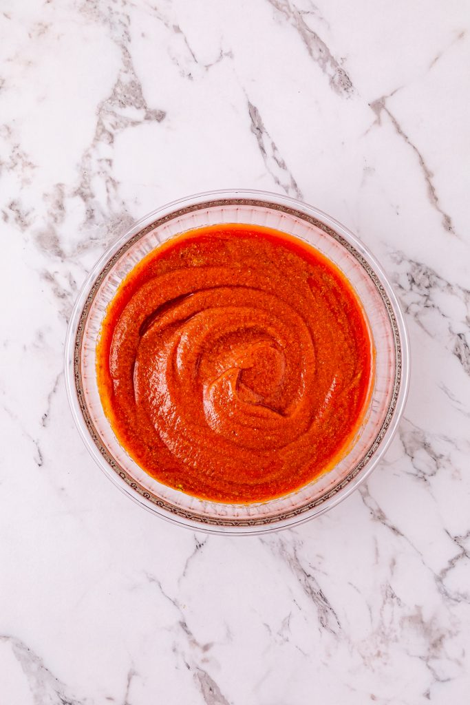Seasoned tomato sauce mixed in a small bowl.