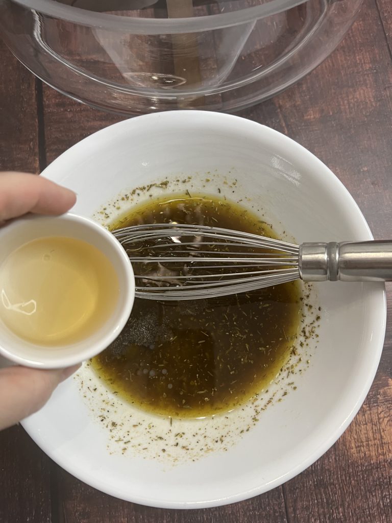 Add white wine vinegar.
