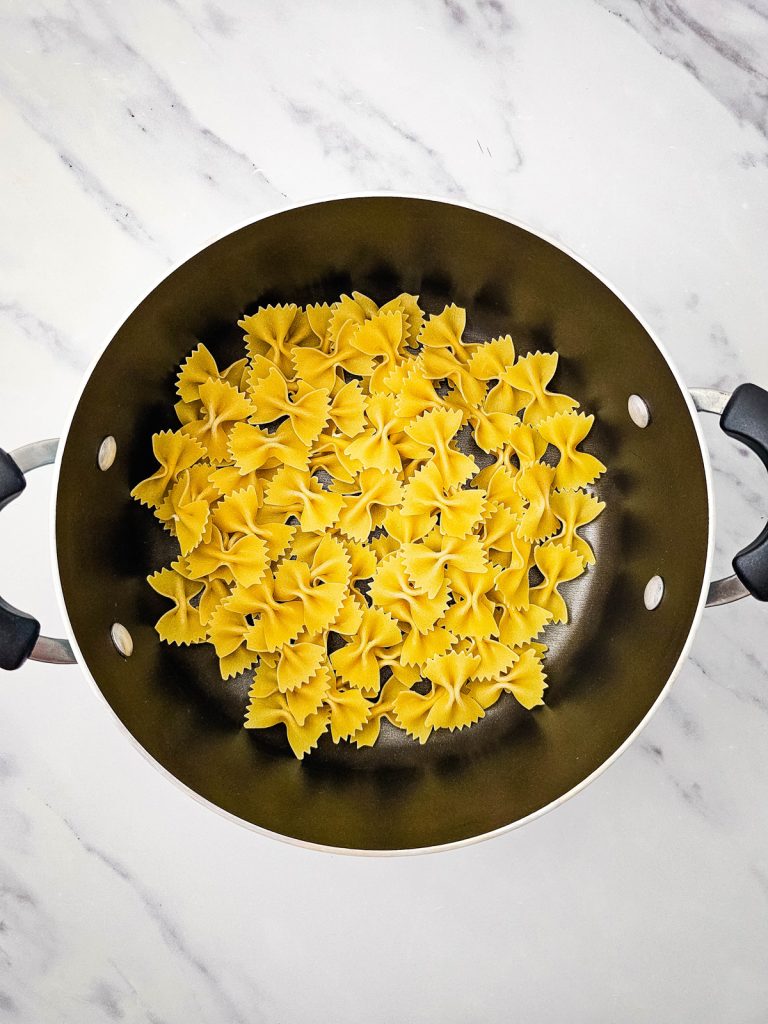 Bowtie pasta in a pot.
