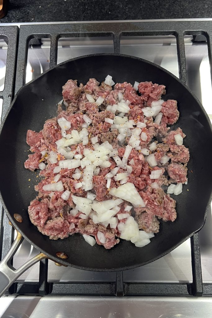 Cook ground beef and onion.