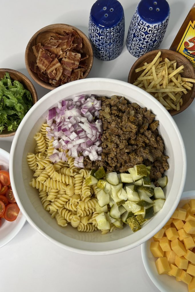 Pasta salad ingredients in a bowl.