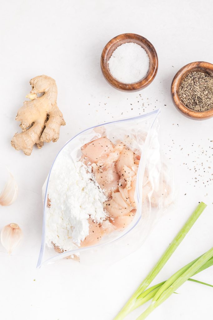 Place cut up chicken pieces in a plastic bag with the cornstarch. Shake to coat.